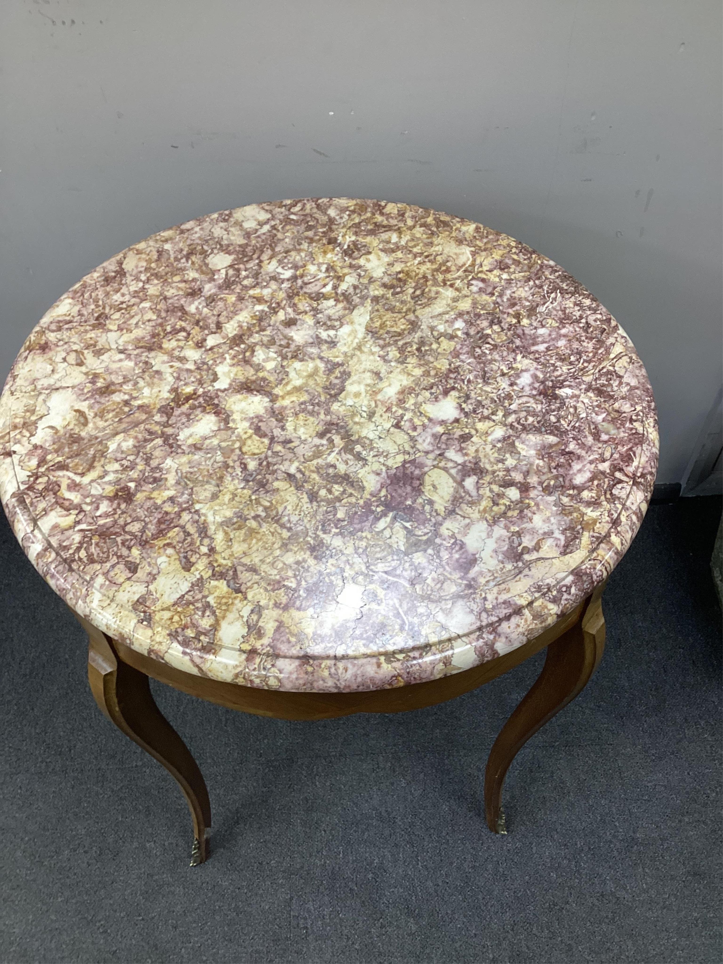 A Louis XVI style circular banded kingwood marble top centre table, diameter 65cm, height 71cm. Condition-good